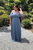 The dress was a hit for a wedding I attended. The color was perfect and I loved that it was not tight at all. The two things that were a little bit of a downfall but were manageable were that the top area was a little too loose so I had to pin it & it was long so I would suggest trimming it. But overall I loved the dress got a lot of compliments would definitely recommend it! - Ilse F.