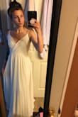 The dress does fit pretty tightly, I should have ordered a small rather than an extra small. The dress is heavy on the bottom with fabric, the length was just a tad long but not too bad, and it is not see-through, which is perfect. This dress, for the price, was great for my wedding. - Allison N.