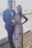 I originally ordered both a small and XS, and ended up going with the XS, I wanted it tighter in the bust so I didn't have to worry about finding a strapless bra that would stay up. I wore this to a wedding and got so many compliments!! I had to get it hemmed a little bit since I'm shorter but I have to do that with most maxi dresses. - Melissa D.