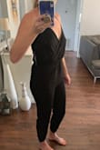 After using other reviews to help select a size I ordered a size small, which is also my usual size at Lulus. The jumpsuit was tight on me from my knees up to my belly button and also a bit short. Feels more like an XS than a small. Unfortunately, I'll have to return it even though the quality and style is very cute. - Mandi W.