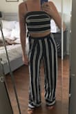 The fit and length is perfect. I have long legs and although I won't be able to wear heels with it, it's going to be perfect for any flats. The top ties up and the bottoms have an elastic band in the back to allow a tailored fit. I can't wait to wear this outfit out! - Mandi W.