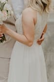 This is a lovely, simple dress that was perfect for my elopement. The fit was perfect, I only had to have the length altered but every other part of the dress was perfectly snug. There is plenty of lining to make sure nothing is see through, and the material of the entire dress is thick and good quality. It doesn't feel thin or cheap. I loved it! - Sarah C.