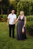 I wore this for my engagement photos and it was PERFECT! The dress was a little snug at first and wouldn't zip all the way, but as soon as I pulled it down to my natural waist, it fit great. Despite being a little tight, it was really comfortable! I love how this dress flows and photographs. The fabric is high quality and, with multiple layers, feels like a much more expensive dress than it is...definitely a staple everyone should have in their closet! - Katie K.