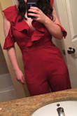 I wore this to a wedding and got tons of compliments. The fit is very flattering in the waist, but had a bit more cleavage than I expected. The color was very nice for a fall wedding, but I would definitely describe it as closer to burgundy than rust red because it was a darker shade than it appears in some of the pictures. - Kyra M.