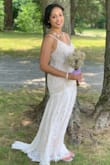 I wore this for my 10 year vow renewal and it was perfect! Simple lace but elegant with just the right train length. I added a rhinestone belt just to make it sparkle. A tailor sewed it on for me and it was a nice touch. I'm 5'4" and did not have to have any alterations. I received so many compliments. Wear nude underwear if possible. - Yoko F.