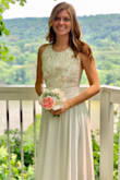 Simple yet elegant. Beautiful lace. I got so many compliments. I have a small chest and if I had a push up bra or the time to get the top taken in slightly, it would have fit perfectly. It is long. I would have also had that altered but I just wore a pair of 3 inch heels and it was just right. - Lauren M.