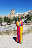 Lovely vibrant dress, nice material and comfortable fit. Of course always too long for us Petites. Would be nice if you started having petite sizes. I always have to spend more to have dresses altered. - Gaetana C.