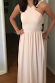 It was a tiny bit tight, but it's surprisingly a good fit for an online purchase. If my bust had been any larger it wouldn't have zipped though. This dress looked great and the colour was a nice pale pink. - Theresa O.
