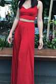 Wore it yesterday to a wedding. Felt super cute. Top was loose, but I was able to adjust it and make it tighter w the straps and strings. The pants were so flowy and fun and the slits are super sexy! A little tight in the waist for a S but probably because I ate so much lol loved the red and really recommend! - Bella P.