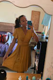 Adorable summertime dress! Nice and flowy, and a beautiful mustard yellow color!! A little loose in the bust; but if tied tight enough it's perfect! Absolutely love it! - Emily M.