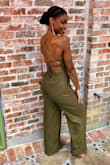 I love this jumpsuit! I love the fact that it is long enough and fits my frame so well. The length is perfect but I will have to take it in a little around the wasit as my waist is tiny and the jumpsuit is slightly baggy around that area. Other than that, it's perfect! Absolutely would purchase again. - Beatrice D.
