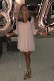 This dress is easy and beautiful. The fit is flattering and the material is great; it washes very well and then hang it up, it's ready for the next wear. I got compliments every time I wear one of the 4 that I have. It was perfect for my birthday party! - Elyse H.