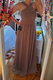 I got this dress for a wedding I'm going to be a bridesmaid in this fall. I was so surprised by how comfortable it was when it came! The fabric is high quality but lightweight and soft at the same time. The color of the specific one we got, Taupe, looks a little different in person/in the light you're in. It's more lavendar looking in person, but I actually like it better. I'm normally between an XS and a S and I got a small just to be safe, but I think an XS would've fit a little better. I have a pretty short torso and the straps and torso of the dress are just a little too long- but the straps will be easy to fix in alterations. Overall, beautiful and comfortable dress! - Allison H.
