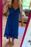 Although the dress is a little bit brighter blue in person, the quality of the fabric is great and the fit is perfect. I ordered a size medium and it's a comfortable fit without being too large or small. Can't wait to wear this dress to a wedding! - Madyson S.
