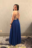 I LOVE this dress! I feel so classy and sexy at the same time. I got a lot of compliments on the straps on the back. You will need someone to help you put this on as the straps can get tangled up. Also, I'm short and even with heels it was still a little long, I had to get a couple of inches hemmed off the bottom. Aside from that, I loved this! - Gabbie T.