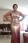 I normally wear a medium, but ordered a large in this dress. It was still tough to zip at my rib cage. It was a tight fit. Also, the color in person is very bright gold and not the pinkish gold (rose gold) that it appears in the picture. - Dana C.