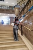 I bought this among many other outfits from Lulus for my birthday trip to Paris. Even though the weather was warm, this was breezy and fashionable. The pants were a little baggy in the crotch but I would not have sized down. - Erica W.