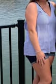 I bought this tank top for a concert and it was perfect. If you are more busty, you might want to wear a bra or bralette, but it will be seen from the back. The straps that you tie in the back are not very wide, so if you have a wide bra or bralette you will be able to see it. - Taylor A.