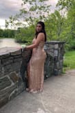 This dress was absolutely perfect! The material was thick and not cheap and the dress stayed up well. The slit was a little higher than I was anticipating but it worked anyway. It was the perfect length, just at floor level with 3" heels. I wore it for my boyfriend's prom and got so many compliments. Flatters any body type I HIGHLY recommend! - Aryanna O.