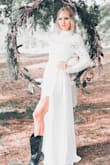 Exactly the look we were going for. I am 5'7 and wore western boots with approximately a 1 inch heel and it hit the ground perfectly. So if you are super tall, it may not be long enough for you. I'm obsessed. Thank you Lulus! - Megan B.