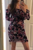This dress looks exactly like the picture and is extremely flattering. Like all other Lulus clothing, it runs a little large but still fits me well thanks to the bodycon silhouette and the ruched elastic. The off-the-shoulder part is still a little large on me but it's not a deal breaker. - Kelsey A.