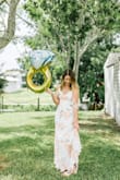 LOVE this dress! I did have to get it altered though. It was too long for my height and they took some of the sides in to shape it more with my body. Not sure if I should have just gotten an XS. - Ashley F.
