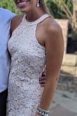 I ordered a medium and the dress fit like a glove! The material is very nice and has some stretch to it as well. I received many compliments on this dress that I wore to a wedding. - Madison K.