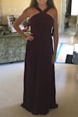 I ordered the M due to sizing chart. I would say I was in between S and M but didn't want to worry about it being too tight. It fits nicely but will need a few alterations which is fine with me. The length is perfect for wearing a heel. I loved the color. It is very elegant. - Karen R.