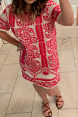 I got lots of compliments while wearing it. It isn't fitted so it can look kind of boxy if you don't have curves, but the embroidery is gorgeous and it has a layer under it so it won't be see-through. I would size down as it does run very large. - Karina C.