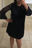 I love the design and the fabric is light and soft. It runs a bit big on the shoulders but sizing down would've been too tight. Over all it's a nice dress that can be worn for any occasion. - Karina C.