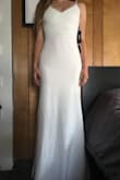 I bought this dress to wear as a dancing alternate for my wedding reception since my wedding gown is wide. I love the fit and shape of this dress. Material is smooth and stretches, but it doesn't bunch, sag or see-through (thin liner inside). The fabric is formfitting and supportive but not too heavy. It's a little long (but perfect with my 3inch heels in the picture), and strap adjusters are a little bulky. This is a well made dress, and I'm so excited to dance in it on my wedding night. - Makenna S.
