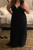 Gorgeous sexy dress, but still classy enough for a black tie optional wedding. The navy color is beautiful. I got a number of compliments on it and felt great in it. A smidge loose on top for me, but won't be a problem for girls with bigger "girls". The skirt flows over hips very flatteringly. With the plunge neckline I opted for a stick on bra, but it was still a struggle to keep the bra from showing. It does run quite long: I'm 5'6", wore 3" heels, and the skirt still touched the ground. Photo is without heels on. - Katie V.