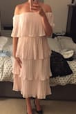 I'm typically a M, sized down to a S and am glad I did. I liked this much more than I thought I would. It's fun, flirty, and can be dressed up or down. Love it! - Holly H.