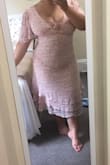This dress is a perfect blend of pretty/classy and sexy. The lace up top gives a nice amount of cleavage thats still partially covered up. I love the flowy little sleeves because I'm kind of insecure about my arms so that's nice. The zipper is really good and smooth as well. It is longer than I expected but I'm also 5 feet tall so I can't complain really. It's a very flattering dress for a curvy girl like myself and I imagine it would be just as lovely on a smaller person as well. - Natalie G.