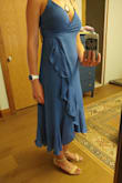 This dress has really nice movement and looks great when I turn slightly to the side. However, when I face full front it's a little frumpy looking as my hips and waist disappear under the fabric. Maybe it will be a little better paired with taller heels? I would also say it's slightly on the small side but can be really adjustable because of the way it wraps. I'm not sure if I'll keep it or not. - Brittany M.