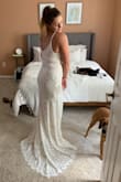 I'm planning my wedding on a tight budget and couldn't justify spending hundreds or even thousands of dollars on a dress that I will wear once. This dress is stunning, comfortable, and so affordable without sacrificing quality! My only complaint is that the slip underneath seems to roll up easily. The little train is an elegant touch. I love it and am so happy with this dress! - Christine M.