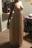 I ordered this as a bridesmaid's dress for my friends wedding. The fabric is a lot heavier than I expected but for the price, the quality was great. If I had another reason (outside the wedding) to wear a champagne colored dress, I would definitely wear this one! It's exactly like the website. The waist is a little bit big on me, but that's a common problem for dresses and my body type. The other thing was that it's pretty long. I wore 2" block heels in the photos below and it still trailed on the floor. Overall, if you're looking for a cheap but beautiful option for a wedding (brides, be nice and pick something reasonable!) this is a great option! - Lexi B.