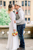 This dress was perfect for my courthouse wedding! It was so beautiful and comfortable. the sleeves were a little loose but worked. I normally wear a size medium but I ordered a small and glad I did. Overall, I definitely reccomend this dress if you're looking for an affordable but yet beautiful dress for your special day, or any other occasion. - Jessika D.