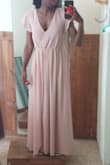 I ordered an xs and it was still a bit loose and the trim was so long I would have to wear 3 in heels with it. I had the dress altered so in th photo is how it turned out. - Mary S.