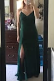 The dress IS absolutely beautiful but I was disappointed when it didn't look flattering on my body. It gives me no figure. The dress definitely drapes and I thought by getting a small it would be somewhat "tight" around my waist. But it was too big and too long as well. I should've went a size down. I recommend getting a size down! - Alexis L.