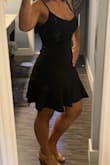 So I stated runs large because for some reason every Lulus dress I've bought has been too big in size medium and I'm a solid medium in all my other clothing brands, but size smalls def fit me better for this brand. The quality of this dress is amazing, thick, but has some stretch. Can def wear a strapless bra, has adjustable straps with cute gold clasps. I thought the length was perfect, not too long, and not too short. The flounce on the bottom is just enough and lays just right. Overall I am very happy with this purchase, what a fun twist for a LBD! - Samantha Z.