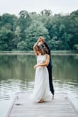 While the quality and the style of the dress is exactly what I wanted, I had to spend $150 to have the three layers shortened because the dress was 8" too long. - Amy B.