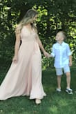 This dress is beautiful. I'm typically not a v-neck person but took a chance and it was worth it. Very flattering. Overall great quality and pretty heavy. Periodically I would step on the dress (I did not alter the length). - Briean H.