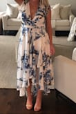 This dress is very well made and lined. 
Colors are exactly the same as picture shown. It will be great for a Tennessee wedding in August. It is a little tight in the waist which does say in the description that it's very fitted at natural waist. I'm in between S and M in Lulus but after reading the reviews I knew the M would be way big at the top. 
I am having the top altered, thank goodness my mom can sew. She's taking an inch off right where my shoulders are. 
I'm a full C cup and the top was huge on me. 
Beautiful dress though and wasn't too long after heals on my 5'2 frame. - Ashley T.