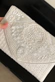 Bought this clutch to match my white attire on my honeymoon. It's beautifully made and the price is great too. - Salma M.