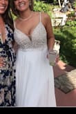 I absolutely loved this dress. I purchased last minute for my wedding reception in June and I'm SO glad I did. I was way more comfortable in this dress than I was in my wedding dress.
I normally wear a size 10, however I ended up keeping the size 8. Fit perfect and I didn't need a bra. I had to add nude lining on the top in the front only, I wasn't a fan of the see through top that shows the bra cups. I would highly recommend this dress!!! - Roxy S.