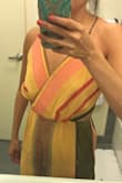 I love the colors of this romper, so I was sad when the top chest area was too large. It was like there was a bunch of extra fabric on the lower bust part. I'm typically an XS/S and ordered XS. Everything fit great except for the awkward fabric on the chest so I returned it unfortunately. - Sonja S.