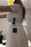 I purchased this dress to wear for my small wedding in Scotland. I wanted something cute and easy to travel with. I feel absolutely beautiful in it and couldn't be happier about how it fits. I have a small waist and a very large bust, so it is a little tight in the chest but I am, obviously, very accustomed to this problem. The tightness isn't uncomfortable or noticeable to anyone but me! I did not give 5 stars because there is a small stain on the inside of the dress. This stain is not noticeable AT ALL when I am wearing the dress, so I will not be returning or exchanging (there was limited availability in my size anyway) but it was a little disappointing. 

Looking forward to my wedding this fall! Hopefully, my luggage doesn't get lost :) - PAIGE G.