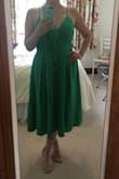 This dress fits like a glove and I felt great in it. It's really flattering and the color is lush. There was a lot of boobage happening with the dress but I played around with the knot to get it to be a little more demure. I packed this dress in a suitcase and let it hang for a day and didn't need to iron it, which was good because the fabric is a bit delicate for the iron, although low heat should be ok. - Anina K.