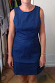 As other reviewers have said, there is a noticeable gap in the back because of the way it snaps, and the arm holes/shoulders gap a little for me too as a pear shaped person. Medium was the correct size for me; the waist and hips fit comfortably without stretch lines. There is not much stretch to the fabric. It is a nice length just a few inches above the knee. I wish I could have kept this because I love the denim look and I love how you could dress it down with sneakers or dress it up with wedges and pearls. The gappy back is really the downfall of this dress. - Elise F.